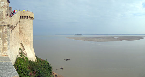 Rising tide around the Mont Saint
Michel 
 The distant sandy island was drowned by the rising water in no time